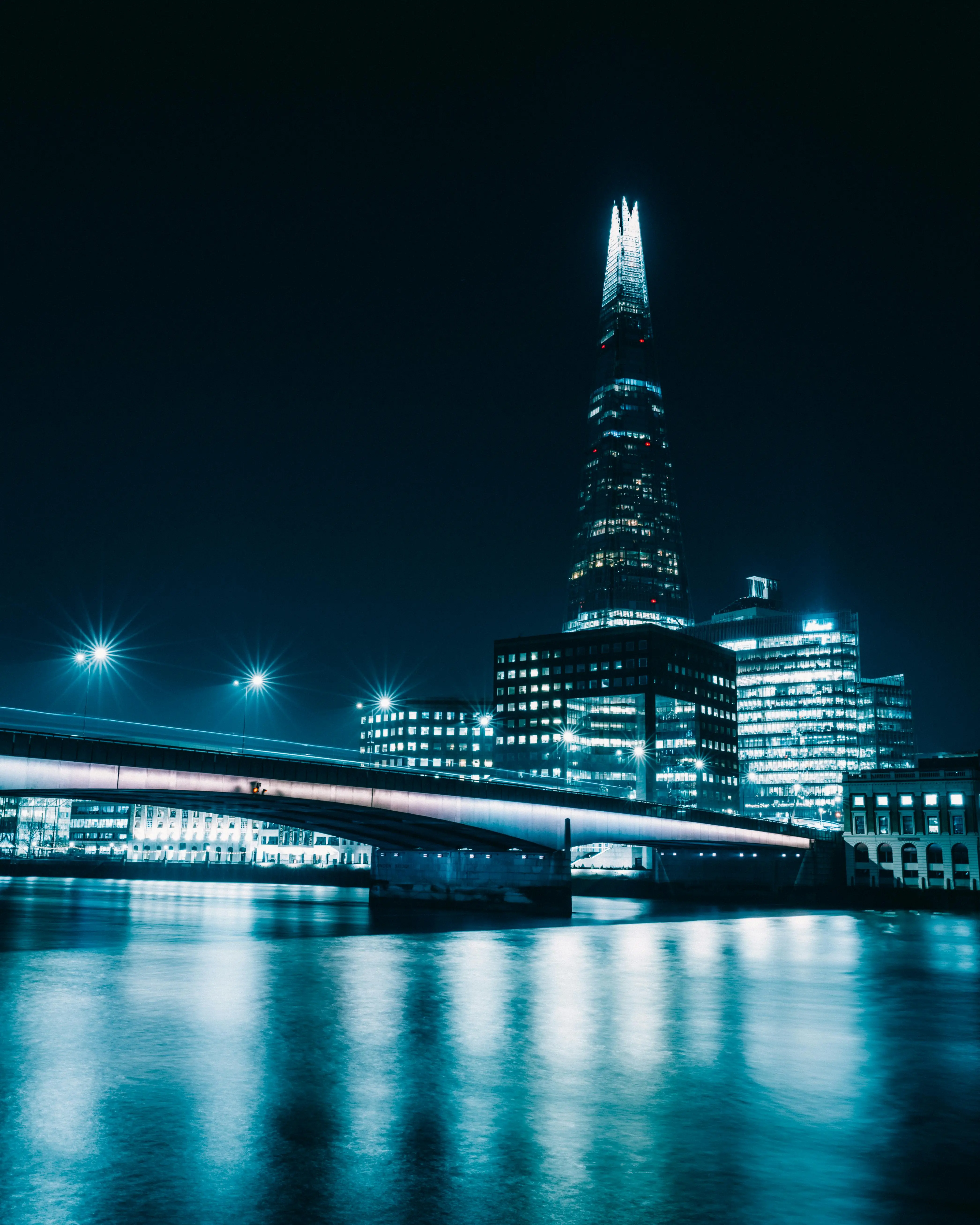 Free Night View of Bridge on Thames and Buildings in Central London Stock Photo